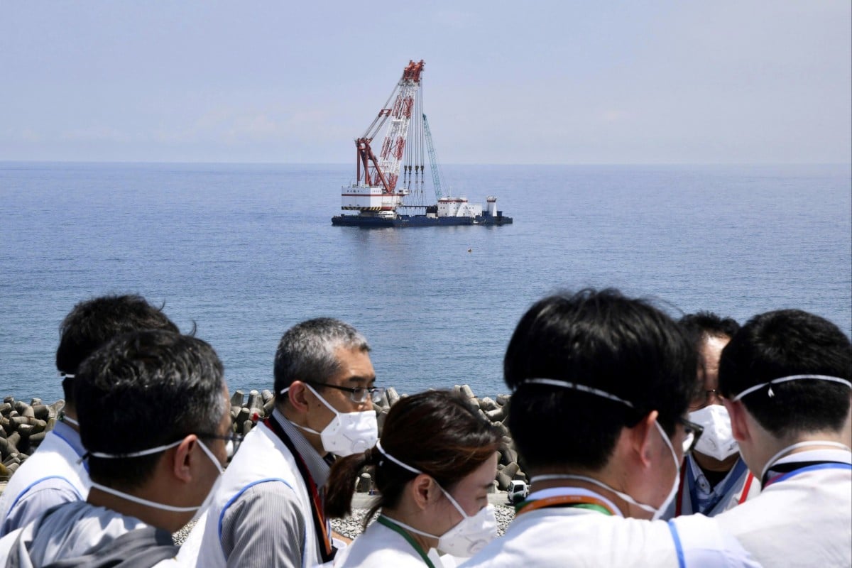 A work ship is seen offshore where the Tokyo Electric Power Company says it has installed  the last piece of an undersea tunnel to be used to release treated radioactive wastewater, during a media tour of the Fukushima Daiichi nuclear power plant in northern Japan on June 26. Photo: AP