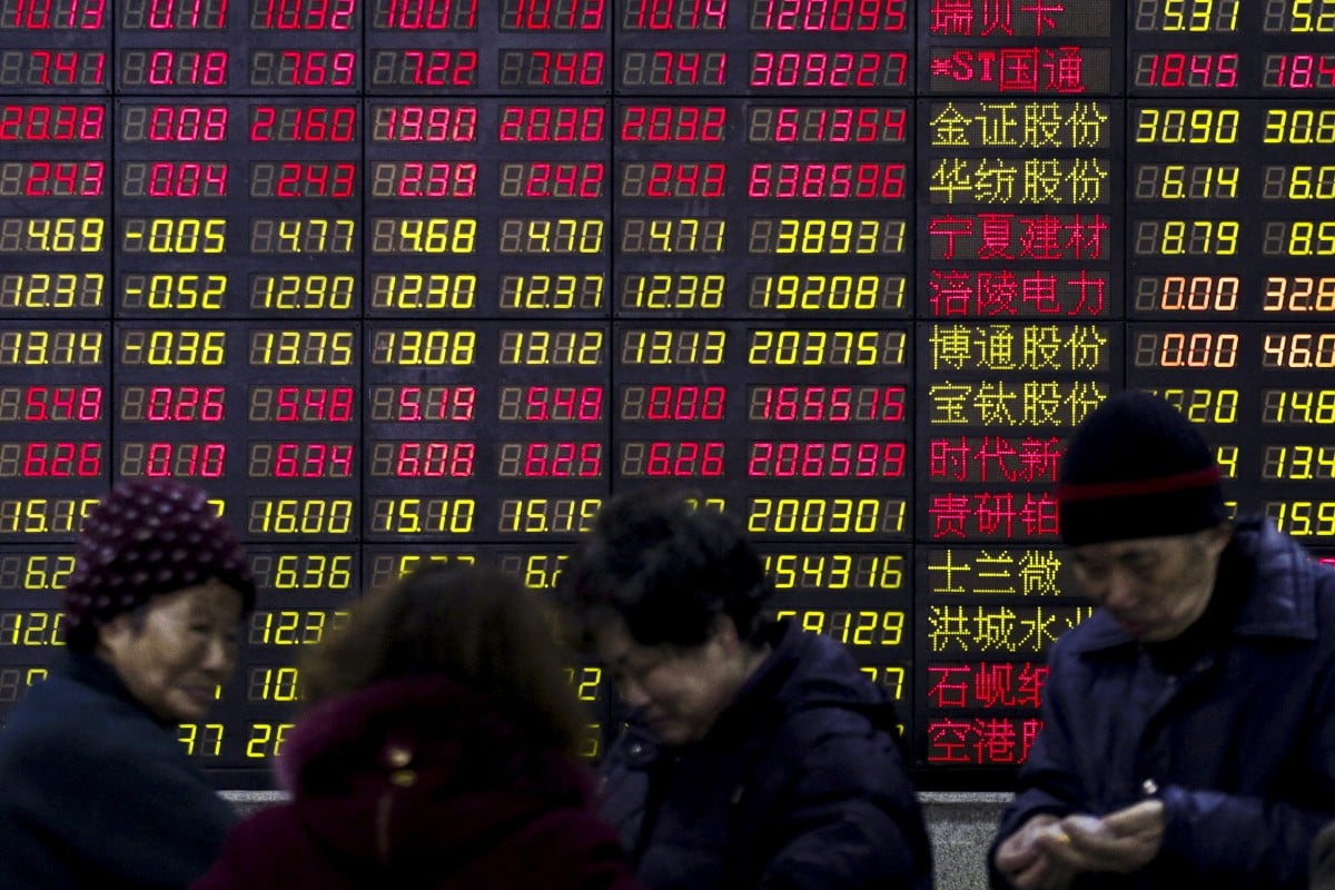 Investors stand in front of an electronic board showing stock information on the first trading day after the week-long Lunar New Year holiday at a brokerage house in Shanghai, China. Chinese companies raised a combined US$31.3 billion from IPO flotations on the Shanghai, Shenzhen and Beijing exchanges in the six months to June. Photo: Reuters